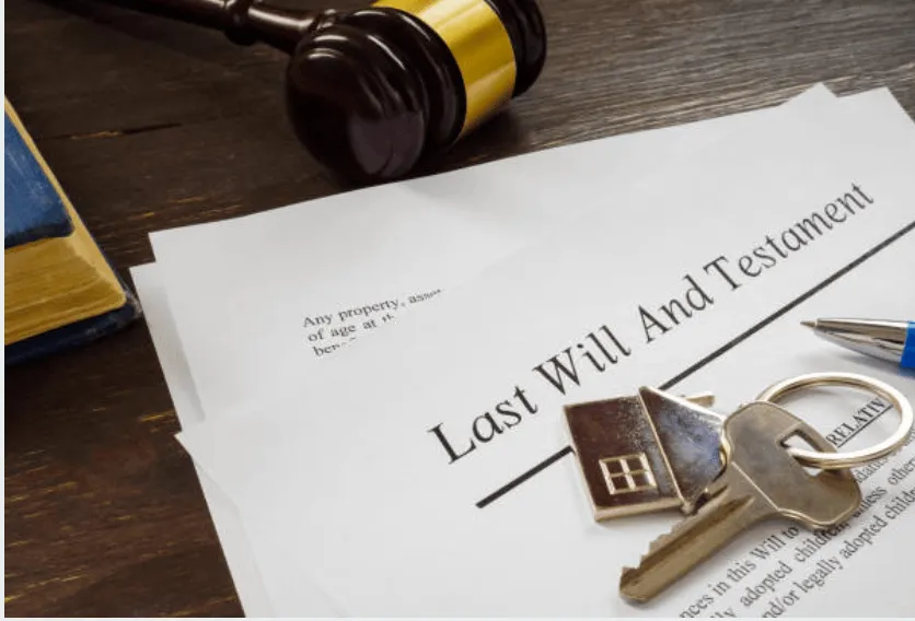 A Last Will and Trust document with a pair of house keys.